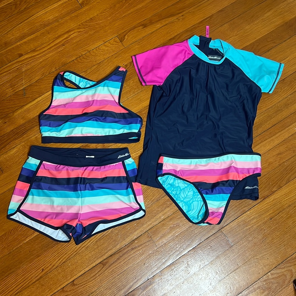 Never worn Eddie Bauer girl’s 4 piece swimsuit set!  Reversible!